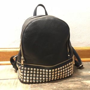 Black and gold studded backpack